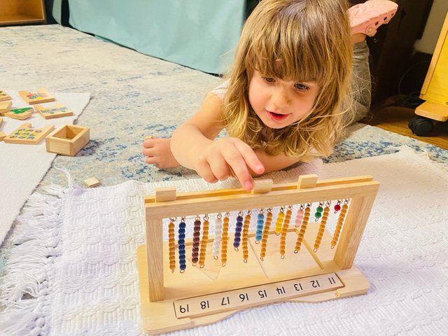 Mixed-age students working together at Spicebush Montessori School