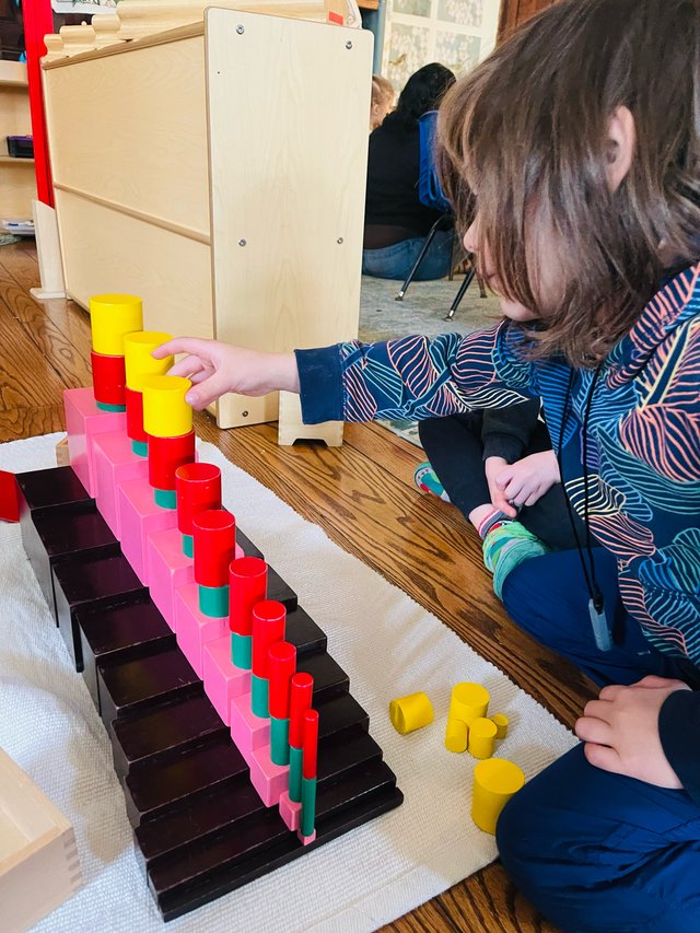 Children exploring nature in the outdoor classroom at Spicebush Montessori School